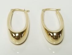 Thanks for shopping our vintage estate store. We tend to sell well below wholesale and truly hope you enjoy all of our items. Many of the items are one of a kind, so please enjoy scrolling through the pictures and hopefully something will catch your eye. Brown spots are from camera or reflections. Beautiful estate 10k yellow gold large dangle tear drop style hoop earrings. Tubes are hollow, but nice as you can see by the weight. Length: 1.25" Width: 15/8" Thickness: 8mm 3/8" Weight: 2.52 grams Beautiful hoops. Marked 10k, some that you will love. As with most estate items there may be some wear on item. We do not sell new items, nor do we charge new retail prices. Vintage 14k Gold Earrings With Polished Finish, Classic Oval Earrings For Collectors, Classic Oval Earrings, Vintage Oval Earrings With Polished Finish, Classic 14k Gold Earrings, Vintage Round Hoop Earrings For Formal Occasions, Hoops Earrings, Brown Spots, Jewelry Earrings Hoops