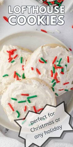 christmas cookies with white frosting and sprinkles on a plate