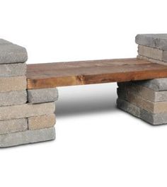 a wooden bench made out of stone blocks