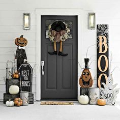 the front door is decorated with halloween decorations