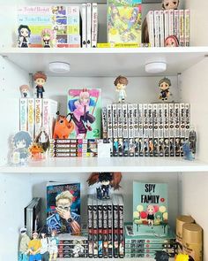 the shelves are filled with books and figurines on them, including anime dolls