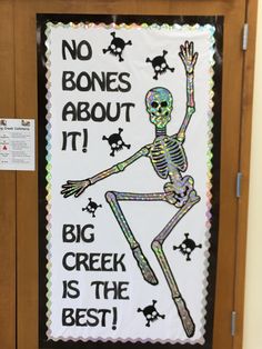 a bulletin board with a skeleton on it