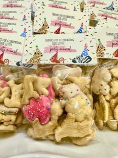 several bags of cookies in the shape of elephants with sprinkles on them