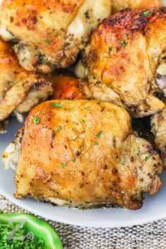 chicken wings on a white plate with parsley