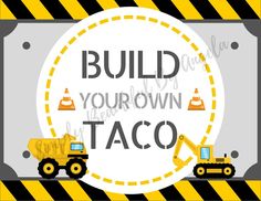 a sign that says build your own taco with construction trucks in front of it