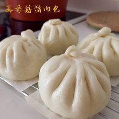 three dumplings sitting on top of a cooling rack