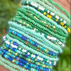 You will receive 10 assorted mixed green STRETCH STYLE seed bead bracelets. Bracelets will be chosen randomly and may/may not include the pictured selection.  This listing contains bracelets that STRETCH. Green Beach Jewelry With 108 Beads, Green Round Bead Bracelets For Everyday, Green Friendship Bracelets With Spacer Beads As A Gift, Green Hand-strung Friendship Bracelets For Beach, Green Bracelets With Colorful Beads For Beach, Everyday Green Bohemian Friendship Bracelets, Everyday Bohemian Green Friendship Bracelets, Handmade Green Beaded Bracelets For Everyday, Green Bracelets With Tiny Beads For Everyday