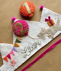 there are two felt ornaments on top of a piece of paper that says happy new year