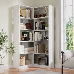 a living room with a white book shelf filled with books