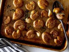 a baking pan filled with potatoes and meat