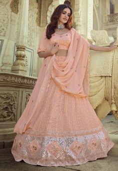 Peach georgette sequins work lehenga choli 7706  Desc:  Style : Circular Lehenga Choli Color : Peach Fabric : Georgette Work : Sequins   Thread Occasion : Wedding   Sangeet   Reception   Social Gathering   Lohri   Gudi Padwa Wash Care : Dry clean Sleeve Style : Half Sleeve Long Sleeves : Done only in Custom Stitch Sleeves Lining : Done only in Custom Stitch Bust Size: 32 to 42 Inches. With Express Free Shipping and Custom Stitching, Buy Indian Wedding Party Wear lehenga Peach georgette sequins w Lehenga Punjabi, Sequence Lehenga, Peach Lehenga, Georgette Lehenga, Party Wear Lehenga Choli, Work Lehenga, Georgette Dupatta, Lengha Choli, Lehenga Wedding