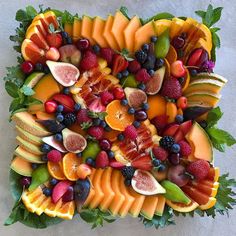 an arrangement of fruits arranged in the shape of a square