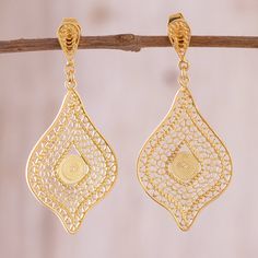 Crafted by hand intricate sterling silver filigree work bathed in 21k gold is hypnotic in its beauty. Peruvian artisan Giuliana Valz-Gen creates this fantastic pair of dangle earrings. Luxury Gold Pierced Chandelier Earrings, Traditional Yellow Gold Chandelier Earrings With Filigree, Luxury Dangle Jewelry With Intricate Design, Traditional Yellow Gold Filigree Chandelier Earrings, Luxury Dangle Filigree Jewelry, Luxury Filigree Dangle Jewelry, Luxury Drop Chandelier Earrings With Intricate Design, Luxury Intricate Design Drop Chandelier Earrings, Luxury Intricate Design Chandelier Drop Earrings