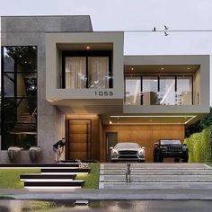 two cars are parked in front of a modern house with stairs leading up to it