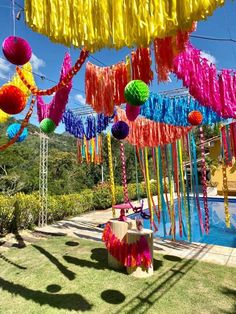 colorful streamers hanging from the ceiling over a swimming pool