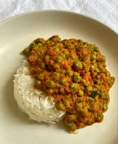 a white plate topped with rice and beans