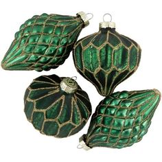 three green glass ornaments with gold trim