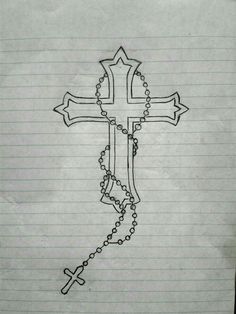 a drawing of a cross on lined paper