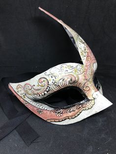 Traditional and original papier-machè Venetian mask, handmade and decorated with acrylics colors. All our masks are handmade papier-machè masks made in Venice. Our decorators use techniques typical of the Venetian tradition such as stucco, acrylics, gold and silver-leaf, macramè, passementerie, pearls and crequelè to give you a wide range of masks. This shape is available in many different designs, colors and techniques. Ask us to personalize your mask! We ship worldwilde with GLS, DHL and Fedex Handmade Fantasy Masks For Carnival, Handmade Fantasy Masks And Prosthetics For Carnival, White Masquerade Mask For Carnival Festivals, Pink Masquerade Mask For Carnival, Artistic Multicolor Masquerade Mask For Carnival, Artistic White Masks And Prosthetics For Carnival, Multicolor Full Face Carnival Mask, Artistic White Eye Mask, Artistic White Masks For Mardi Gras