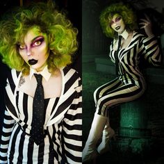 a woman with green hair and makeup is dressed in black and white striped jumpsuits