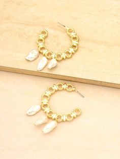 Buy Ettika: Golden Hoop Earrings (E3217-PRL-G-710) and more at Swimwear World. FREE SHIPPING US and Canada. Ship worldwide. Gold Small Hoop Earrings With Pearl Chain, Gold Metal Hoop Earrings With Pearl Charm, Single Gold Hoop Earring With Pearl, Small Hoop Metal Pearl Earrings For Pierced Ears, Small Hoop Pearl Drop Earrings In Metal, Small Hoop Metal Pearl Drop Earrings, Metal Hoop Pearl Earrings With Pearl Charm, Metal Hoop Earrings With Pearl Charm, Hoop Earrings With Pearl Charm