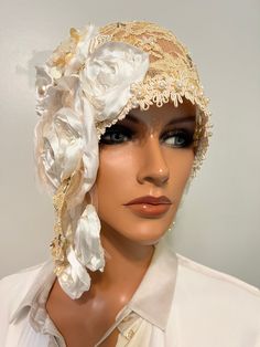 This is beautiful Ladies  flapper hat , headdress, wrap is in antique flapper style daytime hat  has my handmade design is in version of my collection fabulous 20's  and Modern style hats ,heirloom"LudasHatBoutique". Ladies wrap for any occasions. You can wear it many different ways with any dress and will look great costume outfits Era. Asymmetrical hat is made  one of kind cream coffe/ yellowish lace , NOT stretchy lace,handmade floral,  embroidery pearls/glass, antique  trim, pleated floral is in Millinery artwork antique style, nostalgia Wedding 20s , fully stitching by  hands . You can wear it many different ways with any dress and will look gorgeous. This charming piece will fit heads to measure one size fits 23.8"  . Mannequin head is 22". Only hat. Check my other items and maybe yo Vintage Gatsby Style Hat Headpiece, Gatsby Style Hat For Vintage Events, Cream Gatsby Style Hat, Adjustable Cream Gatsby Hat, Cream Adjustable Gatsby Hat, Adjustable Gatsby Mini Hats For Vintage Events, Flapper Style Fascinator For Vintage Events, Adjustable Gatsby Style Hat Headpiece, Elegant Adjustable Cap Headpiece