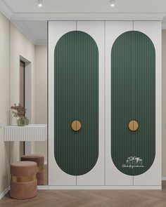 two green double doors in the middle of a room next to a table and stool