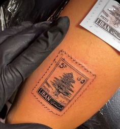 a person with a tattoo on their arm has a stamp that says, banc