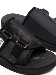 Why not slip into something a little more stylish? With a logo patch detail and a slip-on style - this pair of KAW-Cab slides from Suicoke tick every box. And they even come in one, how handy. Featuring an open toe, a front logo patch, a slip-on style, an open back and a ridged rubber sole. | Suicoke KAW-Cab slip-on slides Casual Slip-on Slides With Tang Buckle, Casual Tang Buckle Slip-on Slides, Black Slide Mules With Textured Footbed, Casual Black Footbed Sandals With Tang Buckle, Casual Spring Slides With Tang Buckle, Modern Black Slides With Buckle Closure, Black Slide Mules With Removable Insole, Modern Slide Sandals For Streetwear, Black Slide Mules With Buckle Closure