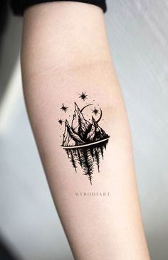 a black and white image of a ship with stars on it's side tattoo