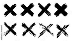 different black crosses drawn in ink on white paper, set of six abstract brush strokes