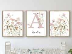 two framed art prints with the letter a and floral flowers in pink, yellow and white