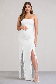 Bring envy to every guest at that upcoming wedding or baby shower in our maternity maxi dress. Susan. Designed in Club L's signature stretch jersey. this long white gown features a bandeau bodice and a floor-sweeping skirt with two ruffled splits. We think Susan would pair perfectly with some diamond drop earrings and a pair of strappy stilettos.Features- Premium stretch jersey- Strapless bandeau neckline- Adjustable cami straps- Invisible zip closure- Double split hemline- Ruffled trims- Maxi l Long White Gown, White Long Gown, Velvet Prom Dress, Bachelorette Party Outfit, Family Pic, Maternity Maxi Dress, Ruffle Maxi Dress, White Gown, Strappy Stilettos