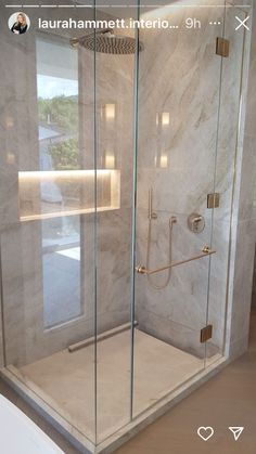 a glass shower door in a bathroom