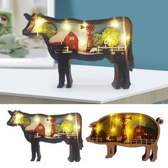 the light up cow is sitting on top of the table