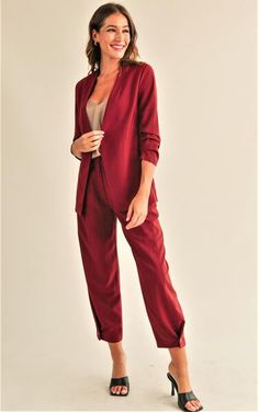 Description Product Details and Fit - Blazer jacket and pants set - Ruched sleeves- One button front closure- Pants with side pockets- Zipper pants closure- Pleated legs with button closure at hem- Adjustable fit pants Model Measurements - Model is wearing a size Small Fabric 100% Woven Style #JSET101 Solid Color Fall Business Pantsuit, Solid Color Business Pantsuit For Fall, Solid Business Pantsuit For Fall, Tailored Versatile Blazer For Business Casual, Business Pantsuit For Fall, Solid Color Fall Pantsuit For Office Wear, Fall Workwear Pantsuit In A Solid Color, Modern Fall Business Pantsuit, Solid Color Workwear Pantsuit For Fall