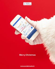 a santa claus holding a cell phone in his hand with the text merry christmas on it