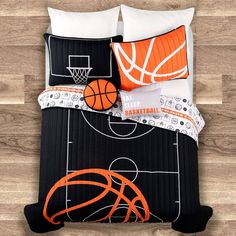 a bed with basketballs and hoop on it