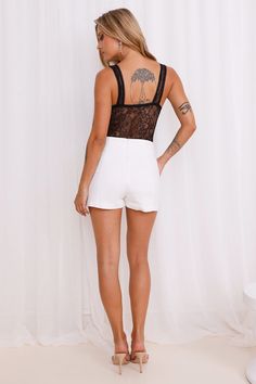 Length from shoulder to hip of size S: 45cm. Bodysuit. Semi-lined. Model is a standard XS and is wearing size XS. True to size. Stretch. Lace. Twist front. Minimal back coverage. Sheer bodice. Snap closures to gusset. Cold hand wash only. Nylon/Spandex/Polyester. The ultimate date night bodysuit! The Passion Perfection Lace Bodysuit features a twist detail to the front, a sheer bodice and a dainty lace design. Style with a skirt or jeans for a 'fit that'll steal attention. Bodysuit Black, The Passion, Lace Bodysuit, Twist Front, Lace Design, Black Bodysuit, Stretch Lace, Design Style, Date Night