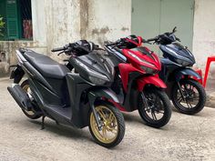 two motorcycles are parked next to each other