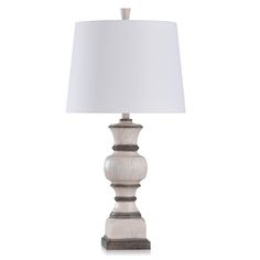 Interject some warm, crisp light into any room of your home with the StyleCraft Traditional Table Lamp. This plug-in, energy-efficient table lamp combines a washed wood grain finish and tapered drum shade, making it ideal for a modern design scheme. This indoor table lamp includes a three-way switch and is a great option for a living room, home office or bedroom space. StyleCraft Home Collection Tipton Farmhouse Weathered White, Grey,Brown 3-way Table Lamp with Fabric Shade | KHL331355DS French Country Table, Brown Lamps, Farmhouse Table Lamps, Traditional Table Lamps, Living Room Home Office, Fixture Table, Wood Grain Texture, Weathered White, Brown Shade