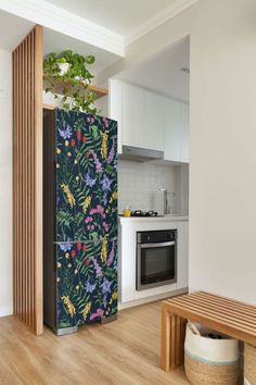 a kitchen with an oven, microwave and wooden bench in it's center area