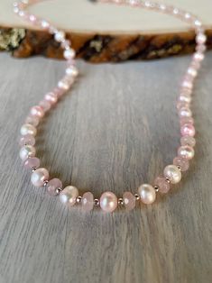 Enhance your style with our Handmade Rose Quartz and Real Pink Pearls Necklace. This elegant piece combines natural rose quartz and lustrous light pink pearls, making it perfect for both day and evening wear.  Whether you're dressing up for a wedding or looking for a casual accessory, this versatile necklace fits any occasion. Ideal for flower girls, a quincenera gift, or as thoughtful business jewelry, its timeless design allows it to shine alone or layered with other pieces.   Embrace the beauty of natural stones with this stunning necklace that adds a touch of elegance to any outfit!   NECKLACE:  18.5" CLASP:  sterling silver toggle clasp PAIR IT WITH:  https://www.etsy.com/listing/1784980240/large-rose-quartz-pointed-pendant-wire?click_key=d72af831cec32ea1d19d77991199db10b35d63de%3A178 Pink Quartz Necklace, Pearl Necklace Simple, Business Jewelry, Simple Pearl Necklace, Pink Pearl Necklace, Pink Pearls, Handmade Rose, Pearls Necklace, Necklace Simple