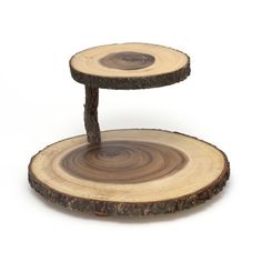 two wooden slices stacked on top of each other in the shape of a tree slice