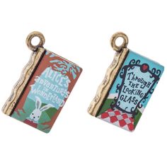 two charms that are sitting next to each other on a white background with the words alice's adventures written below them