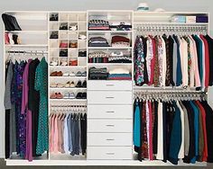 an organized closet with clothes and shoes