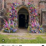 an old building with flowers growing out of it