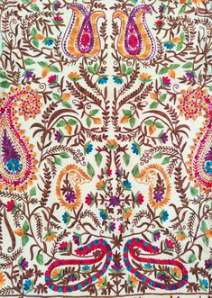 an intricately designed scarf with colorful paisleys and leaves