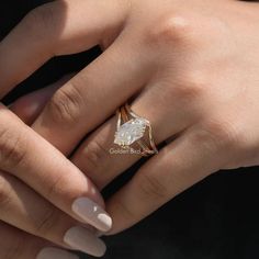 a woman's hand with a ring on it