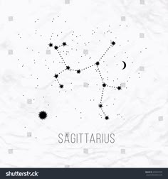 sagittarius zodiac sign on crumpled paper with stars and moon in the sky